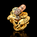 Pill Ring by Damien Hirst and HOORSENBUHS in 18K gold with diamonds and rubies